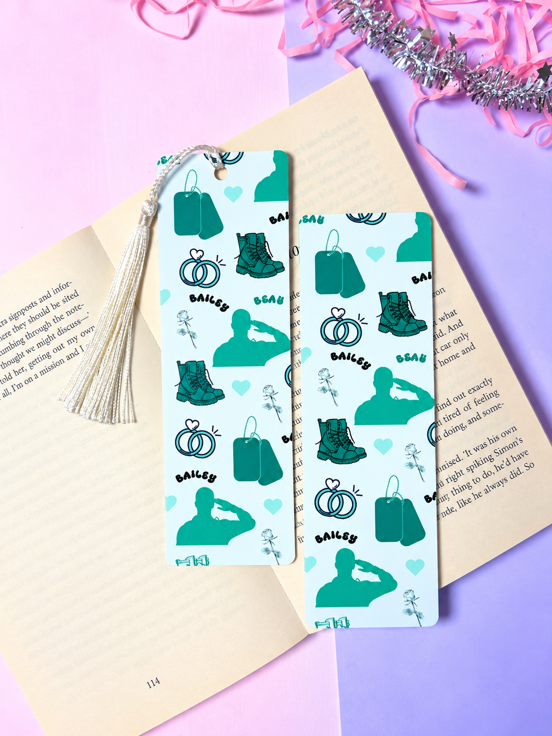 Cowboy-themed paper bookmark pair with teal patterns and a white tassel