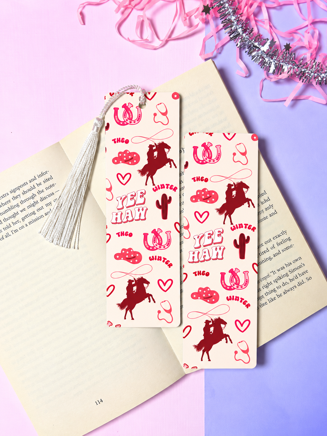 Cowboy-themed paper bookmark pair with red patterns and tassels