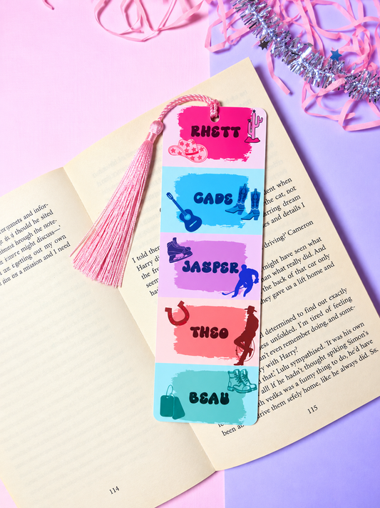 Rectangular cowboy character bookmark with pink tassel and colorful name panels
