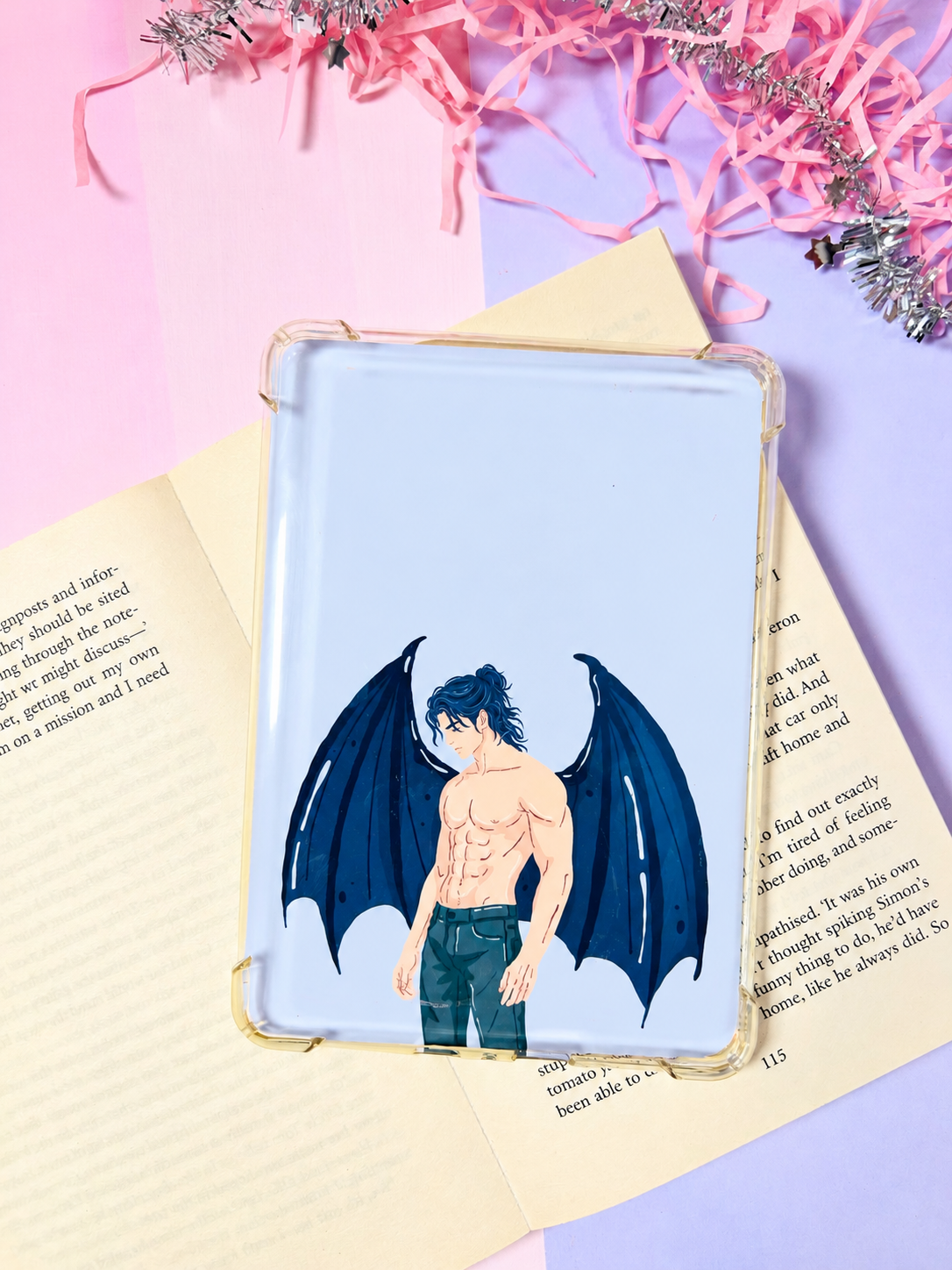 Double-sided Kindle insert with blue winged character graphic on white, framed border.