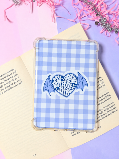Blue gingham Kindle insert in clear sleeve with arched “Book Boyfriends Have Wings” logo