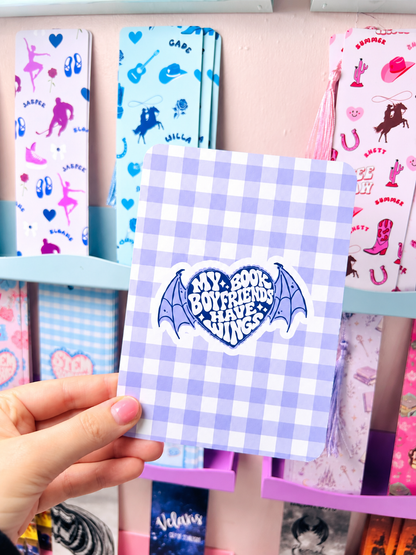 Blue and white gingham Kindle insert with arched “Book Boyfriends Have Wings” logo