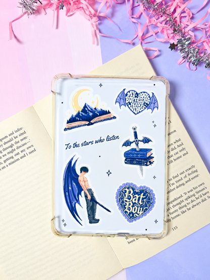 Clear-backed Kindle insert with blue moon, book, and heart badge illustrations