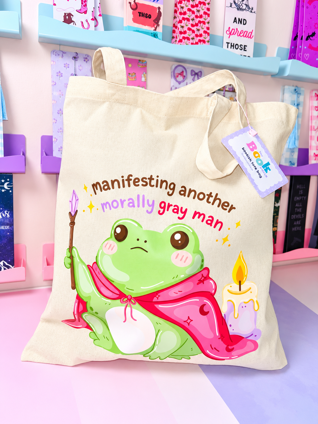Cream tote bag with cartoon frog and candles, short handles, fabric tag attached