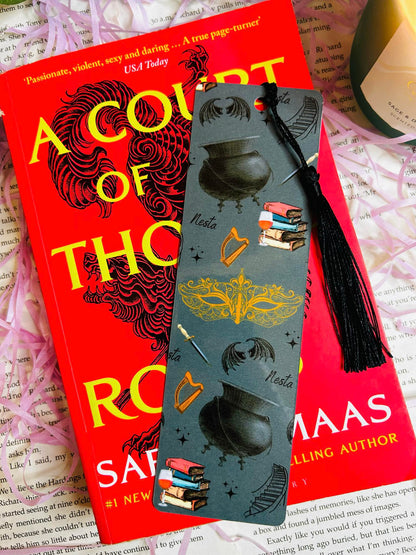 Bookmark inspired by Nesta from ACOTAR with winding stars, harp, masquerade mask, and wine – symbolizing her strength and transformation.