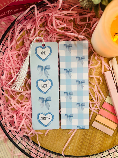 blue girly bookmark, double sides design, one side it says 'one more chapter' in hearts and bows, the other side is a checked pattern with bows