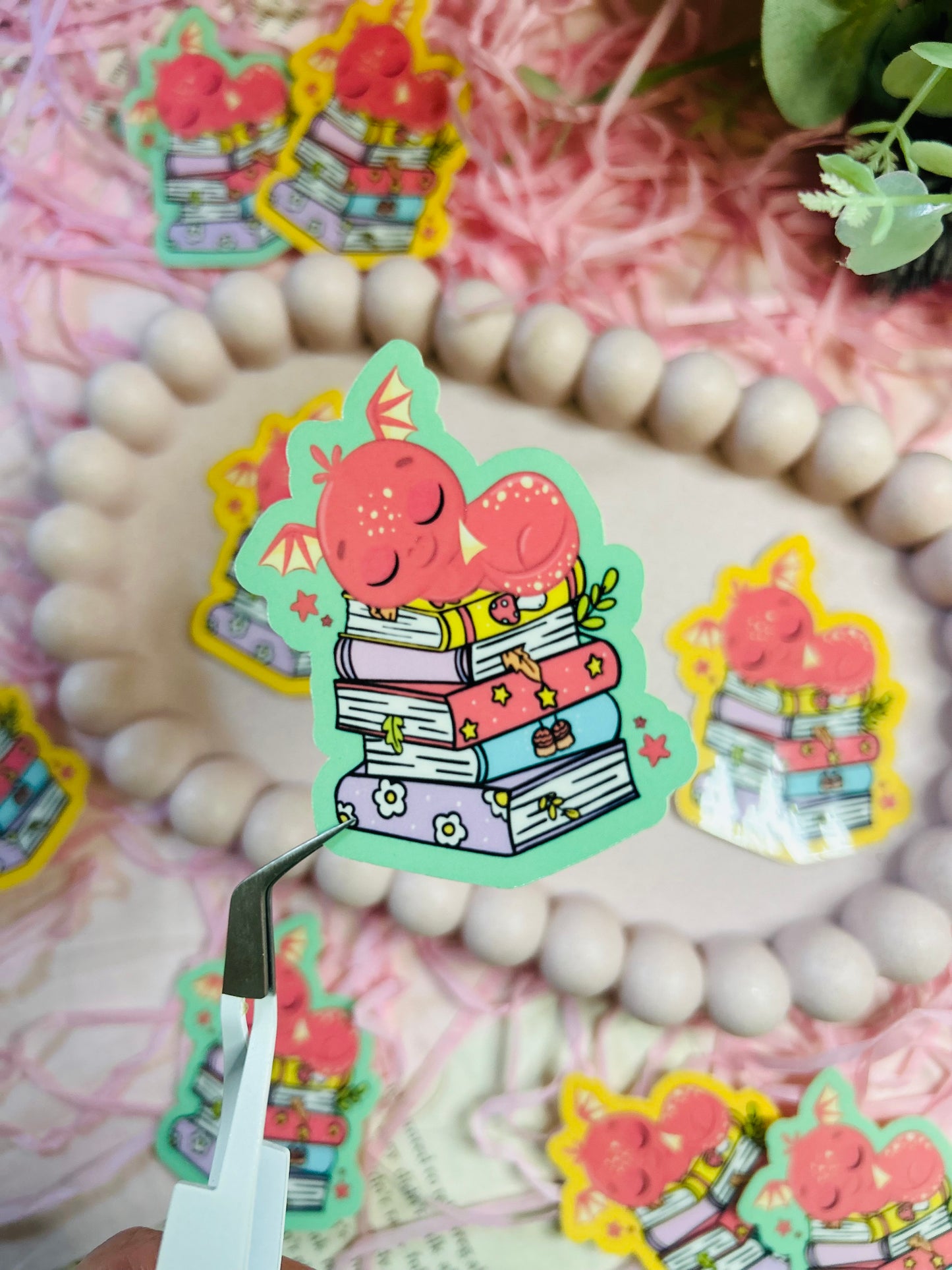  Red Dragon bookish stickers! Perfect for fantasy book lovers, this sticker features a charming red dragon perched on a stack of books.