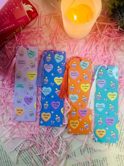 Holographic book trope bookmarks with tassels, featuring phrases like "Enemies to Lovers," "Fated Mates," and "Morally Grey." Perfect aesthetic gift for book lovers and romance readers. ✨📚
