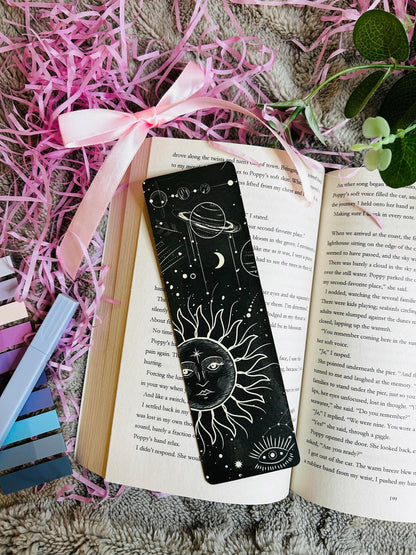 Bookmark with celestial sun and planet design, featuring stars and cosmic elements – perfect for stargazers and cosmic bookworms.