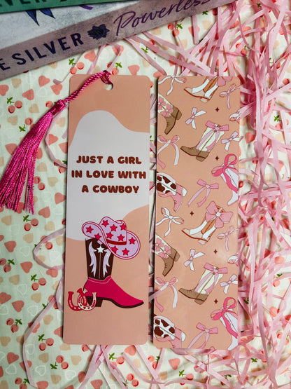 pink cowboy-themed bookmarks featuring tassels and western designs. One side displays the phrase 'Just a Girl in Love with a Cowboy' alongside a stylish cowboy boot and hat illustration, while the other showcases boots and hats adorned with bows.