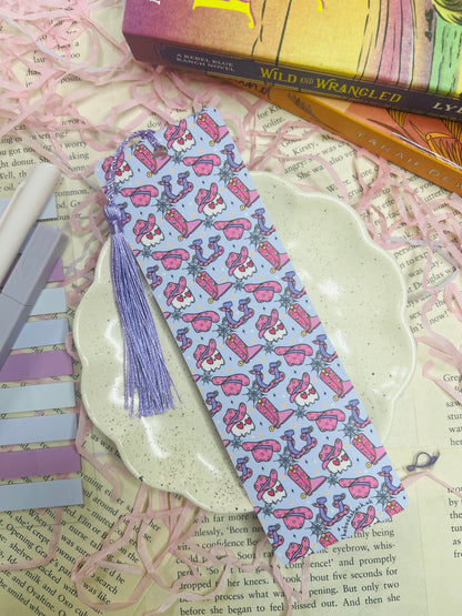 Double-sided purple western bookmark with cowboy skulls, snakes, boots, and hats in a bold design, perfect for dark western and romance readers.