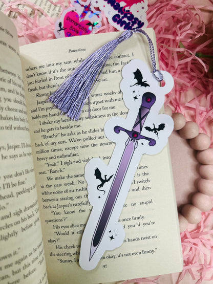 Bookmark featuring a fantasy sword surrounded by flying dragons, perfect for fans of epic fantasy and mythical adventures.