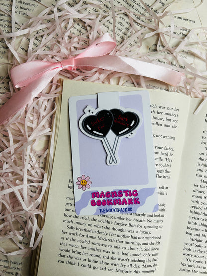 Magnetic bookmark with a bold design showcasing two black heart-shaped balloons that read 'Sucker for Dark Romance.'