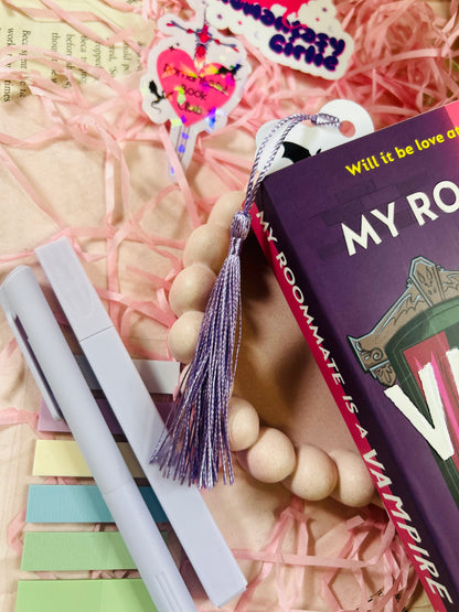 Bookmark featuring a fantasy sword surrounded by flying dragons, perfect for fans of epic fantasy and mythical adventures.