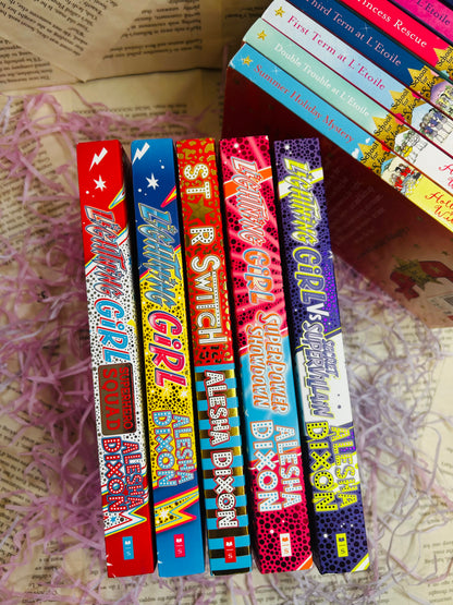 Mystery book bundle for kids with a surprise book, bookmark, bubbles, stickers, and packaging on pink shredded filler.