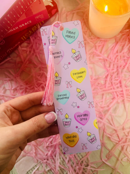 Holographic book trope bookmarks with tassels, featuring phrases like "Enemies to Lovers," "Fated Mates," and "Morally Grey." Perfect aesthetic gift for book lovers and romance readers. ✨📚