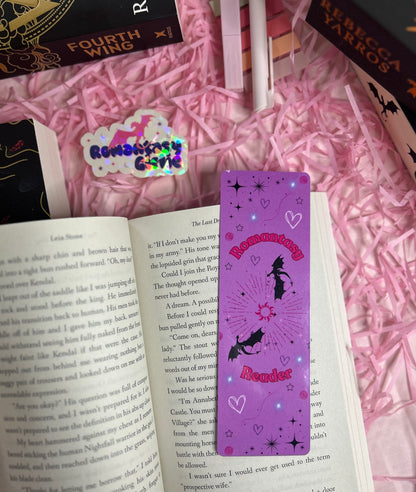 Purple 'Romantasy Reader' bookmark featuring whimsical bats, stars, hearts, and a radiant sunburst design 
