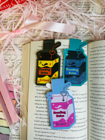 Set of three colourful reading juice-themed magnetic bookmarks, featuring designs for crime, fantasy, and romance genres