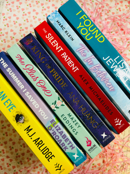 selection of romance, thriller and dark romance book stack