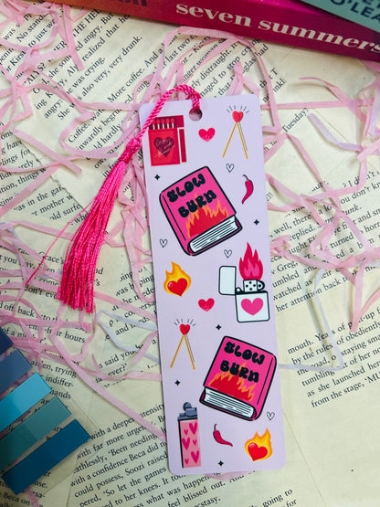 Decorative bookmark with illustrations and tassel on a book page