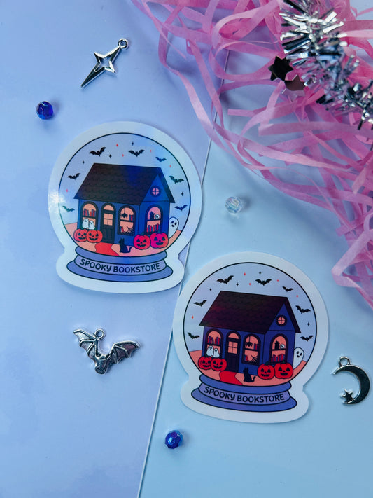 Two 'Spooky Bookstore' stickers on a light blue background with decorative elements.