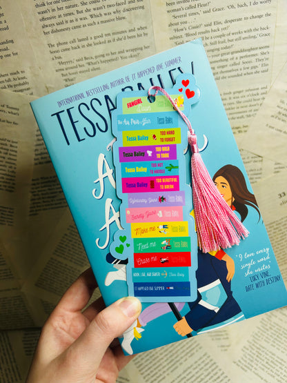 Die-cut bookmark featuring a bookstack inspired by Tessa Bailey’s romance novels, ideal for fans of her passionate, steamy love stories.