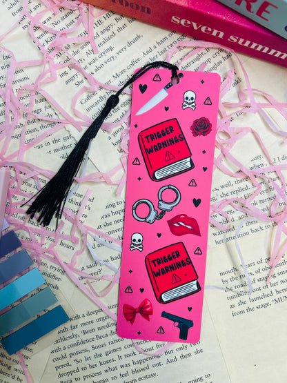 Pink bookmark with graphics on a book page