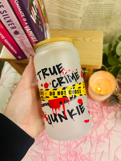 black, red and yellow wrapped glass cup with true crime 